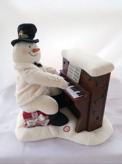 Hallmark jingle pals piano playing snowman.