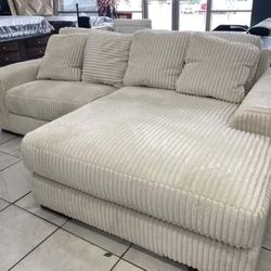 Lindyn Ivory 2 Piece Sofa Chaise Sectional.    Financing Options Available 