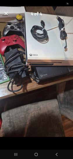 2 xbox one with games cables and 2 controllers