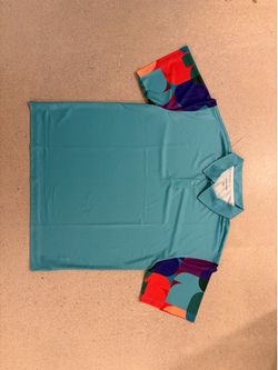 FIFA Hospitality Polo shirt Jersey turquoise blue with 26 graphic on the sleeves