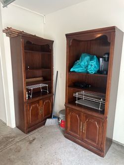 Two brown dressers/cabinets