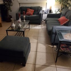 Living Room set consisting of sofa, love seat znd an ottoman, one large center/coffee table,  two (2)matching side tables all have 