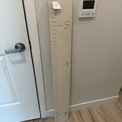 Kid room wood decor with height marker