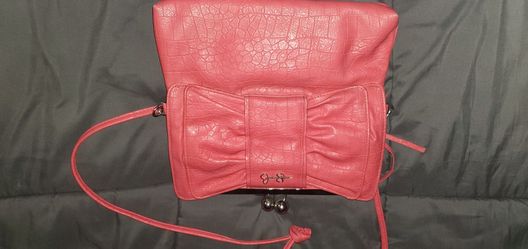Orange crossbody purse from Jessica Simpson