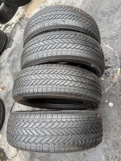 Set of 4 nice Bridgestone 235/65/18 ( We install & balance)