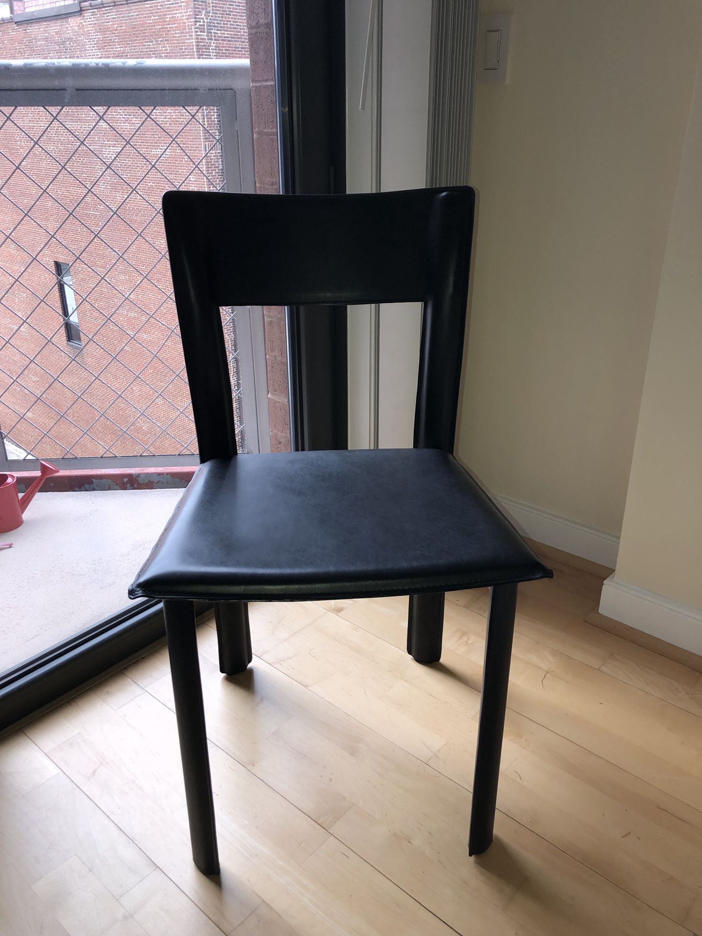 2 black multi-use chairs