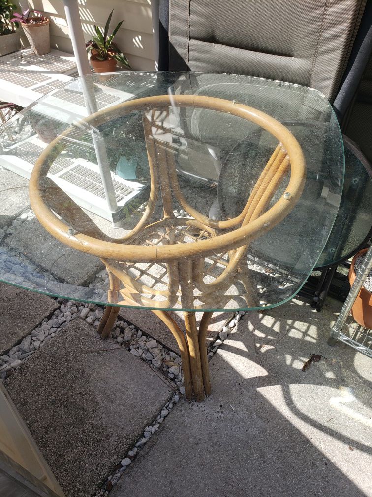 Rattan table with beveled glass top