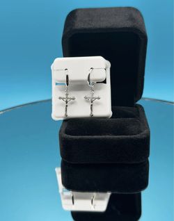 #- 153 Beautiful Moissanite huggie hoop Cross earrings.