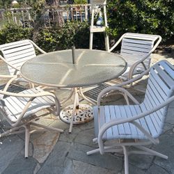 Patio Table And 4 Swivel Chairs. 
