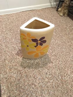 NEW TAN CORNER PLANTER WITH BROWN, ORANGE, AND YELLOW FLOWERS