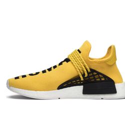 yellow and black human race adias sneakers 
