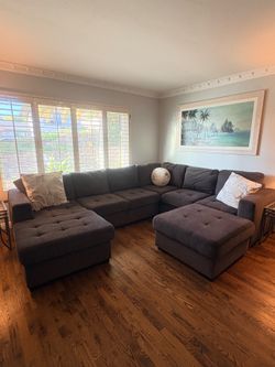 Grey sectional sofa/bed with large ottoman