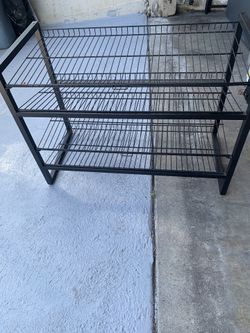 (4) Tiers Metal Shelf Can Be used For Folded TShirts Shoes Etc Or In The Kitchen Or Laundry Room .