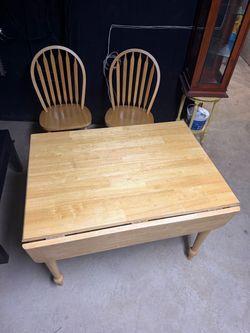 Solid wood (2) wood chairs and (1) table.Pick up only Elizabeth NJ