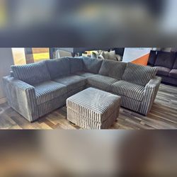 Jumbo corduroy sectional sofa with ottoman