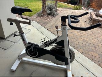 Free Used white and black Spinning Spinner Ascent exercise bike.