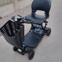 Optimus Automatic Folding 4 Wheel Scooter Easily Fits In Car Trucks Have Control For Open And Closet And Charger Work Great 