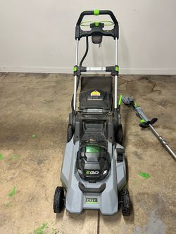 Electric lawn mower with trimmer and charger/battery