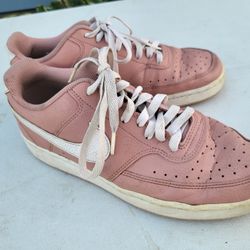 Women size 9.5 Nike mauve tennis shoes
