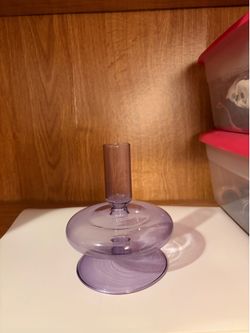 Purple glass candlestick holder