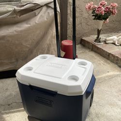 Coleman Ice Chest,  Cooler Wheeled. And With Handle 