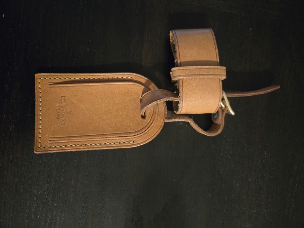 Tan leather Louis Vuitton luggage tag
