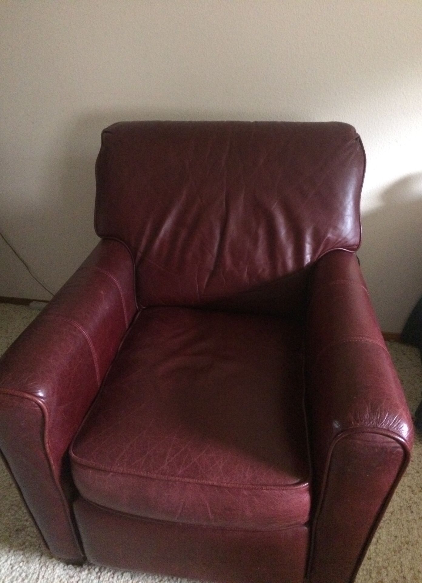 Two Burgundy Lane Leather recliners sold as a pair.