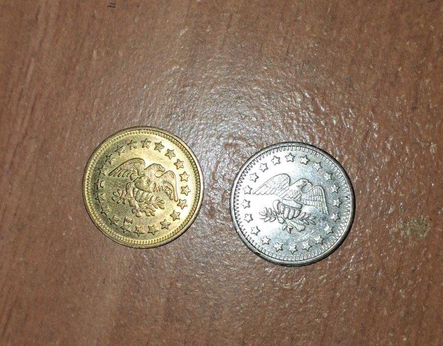 Two Vintage No Cash Value Eagle Tokens.