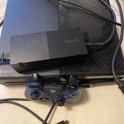 Working On Microsoft Xbox One With Power Supply Box And HDMI Cable With Controller