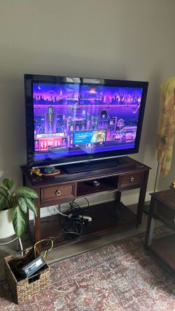 Free TV, Entertainment Center, and End table