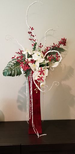 Beautiful artificial flowers orchids arrangement with vase