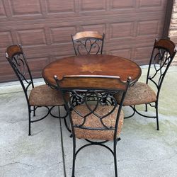 Nola Round Table with Wood Top and Metal Pedestal Base & 4 Side Chairs by Ashley Furniture