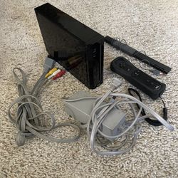 Black Nintendo Wii + motion plus controller and cables for sale or trade