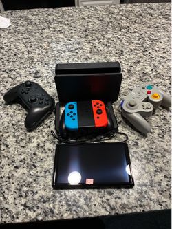 Nintendo Switch OLED + Pro Controller + GameCube Controller + 128GB SD Card