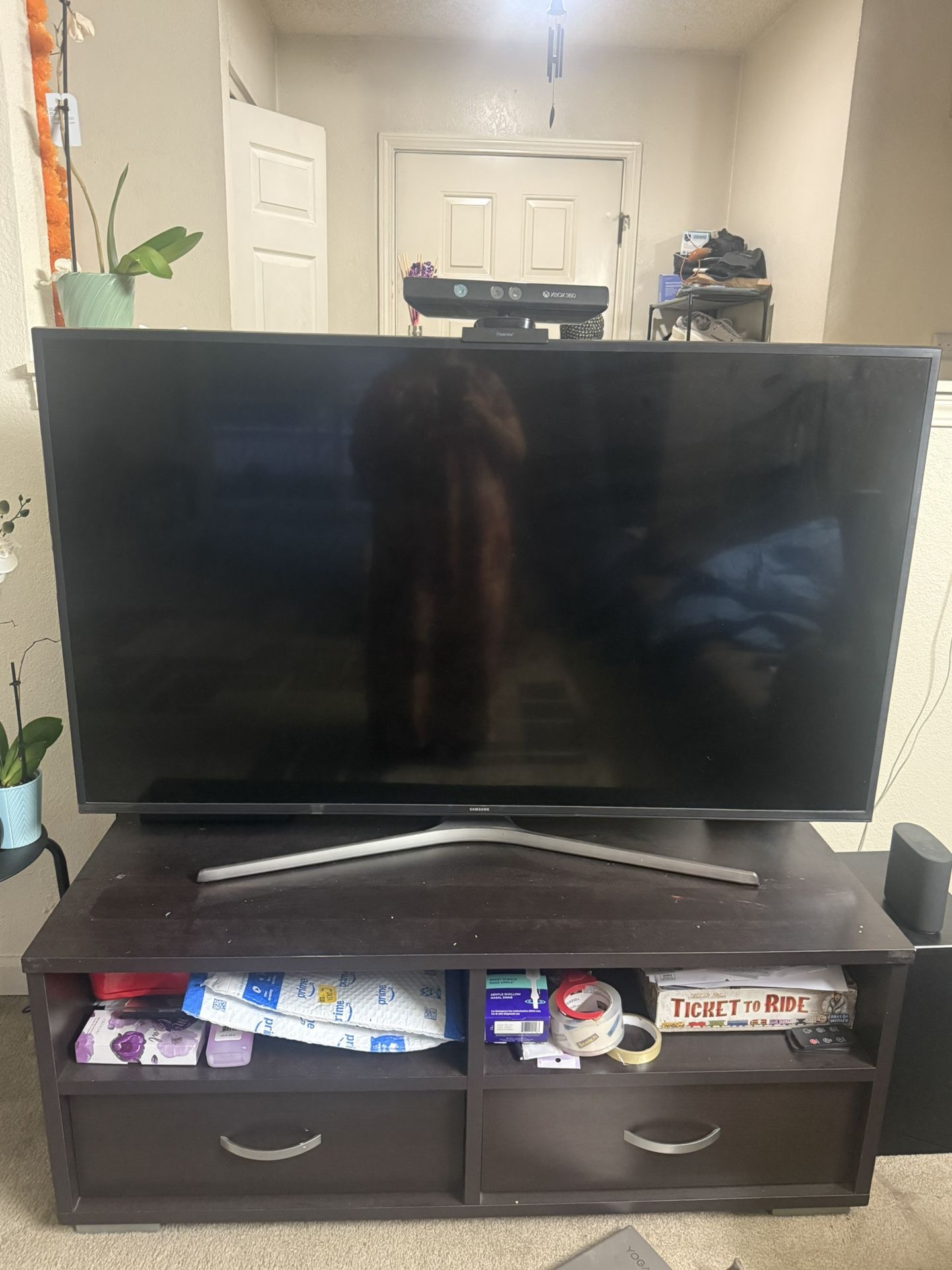 Samsung 55” smart TV along With TV Stand For Sake. In Good Condition