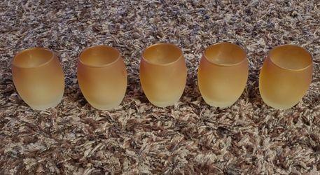 Amber/gold colored set of votive holders