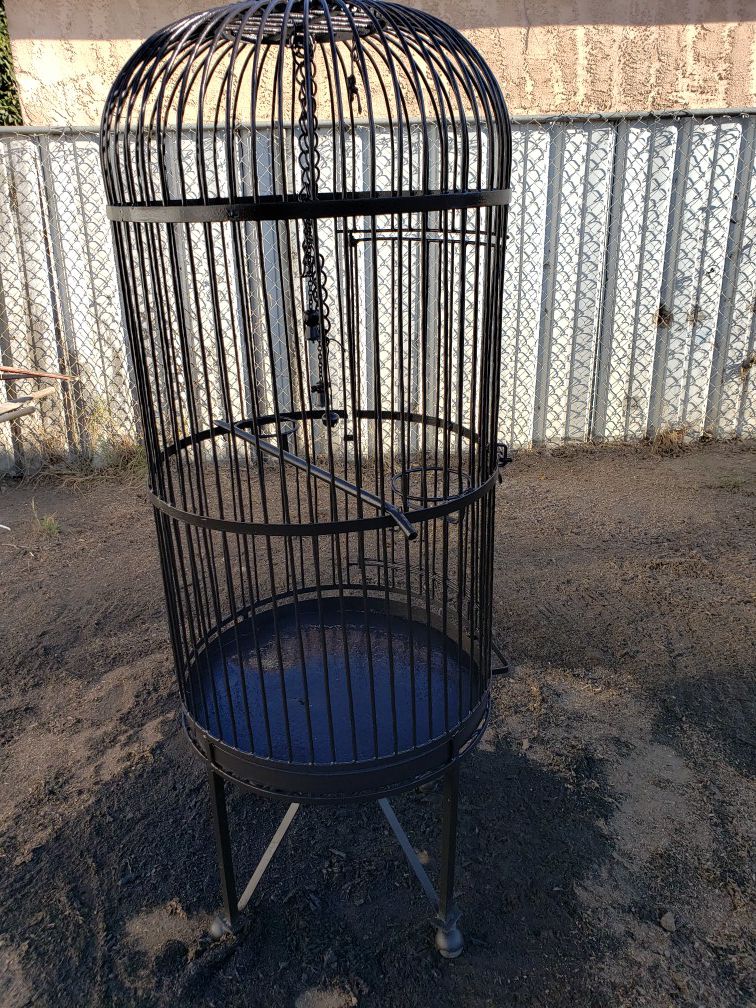 Bird cage iron solid metal bars for parrots or large birds rolling on wheels feeders bars, clean out pan etc freshly painted black.
