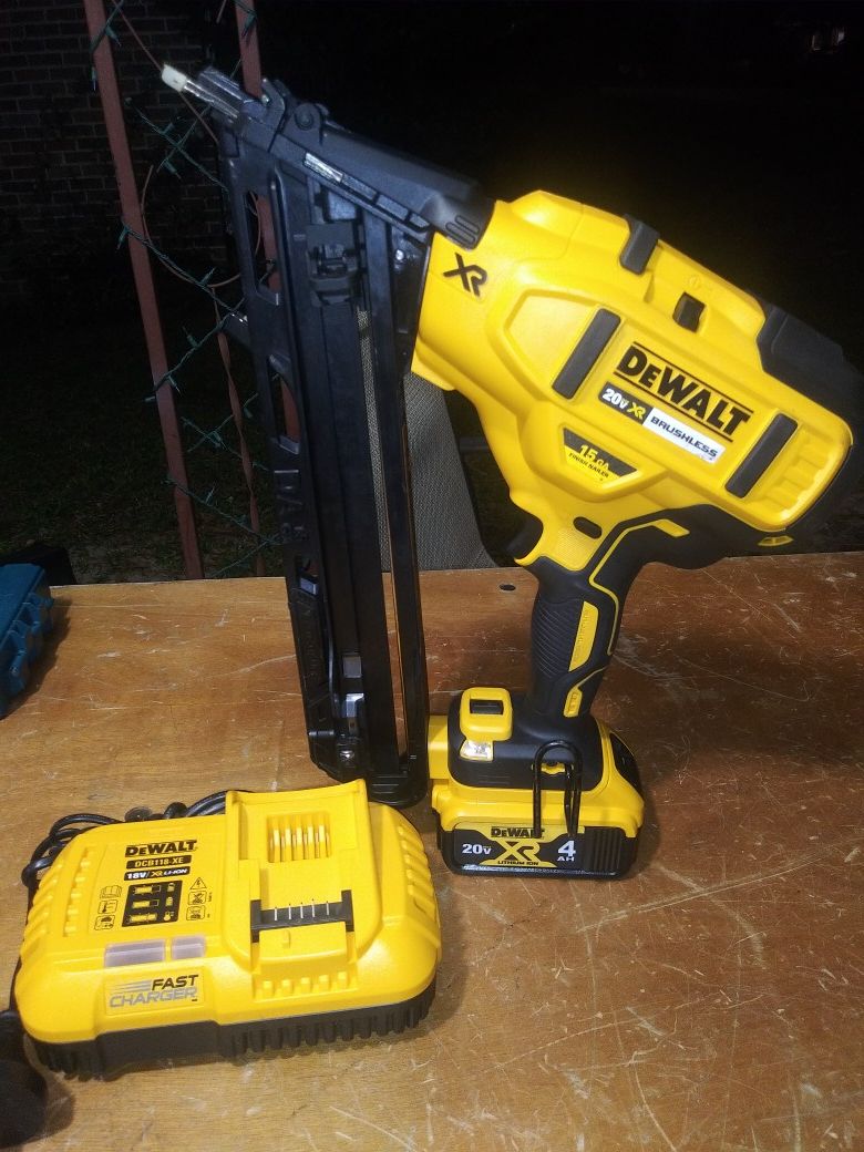 $300. Used-like-new. DEWALT 20-V. XR 15-Ga. Angled Finish Nailer with. 4Ah Battery Pack and Charger.