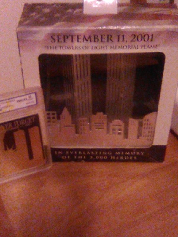 SEPTEMBER 11, 2001 THE TOWERS OF LIGHT MEMORIAL FLAME (2001, Made Item): Along with, NEVER FORGET SEPTEMBER 11,2001(2002 23 KT GOLD COLLECTIBLES).