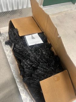 6 foot Christmas tree with lights and Stand  still has instruction in the box. $50