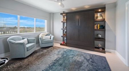 Dark Wood Murphy Bed with Built-In Shelving Unit