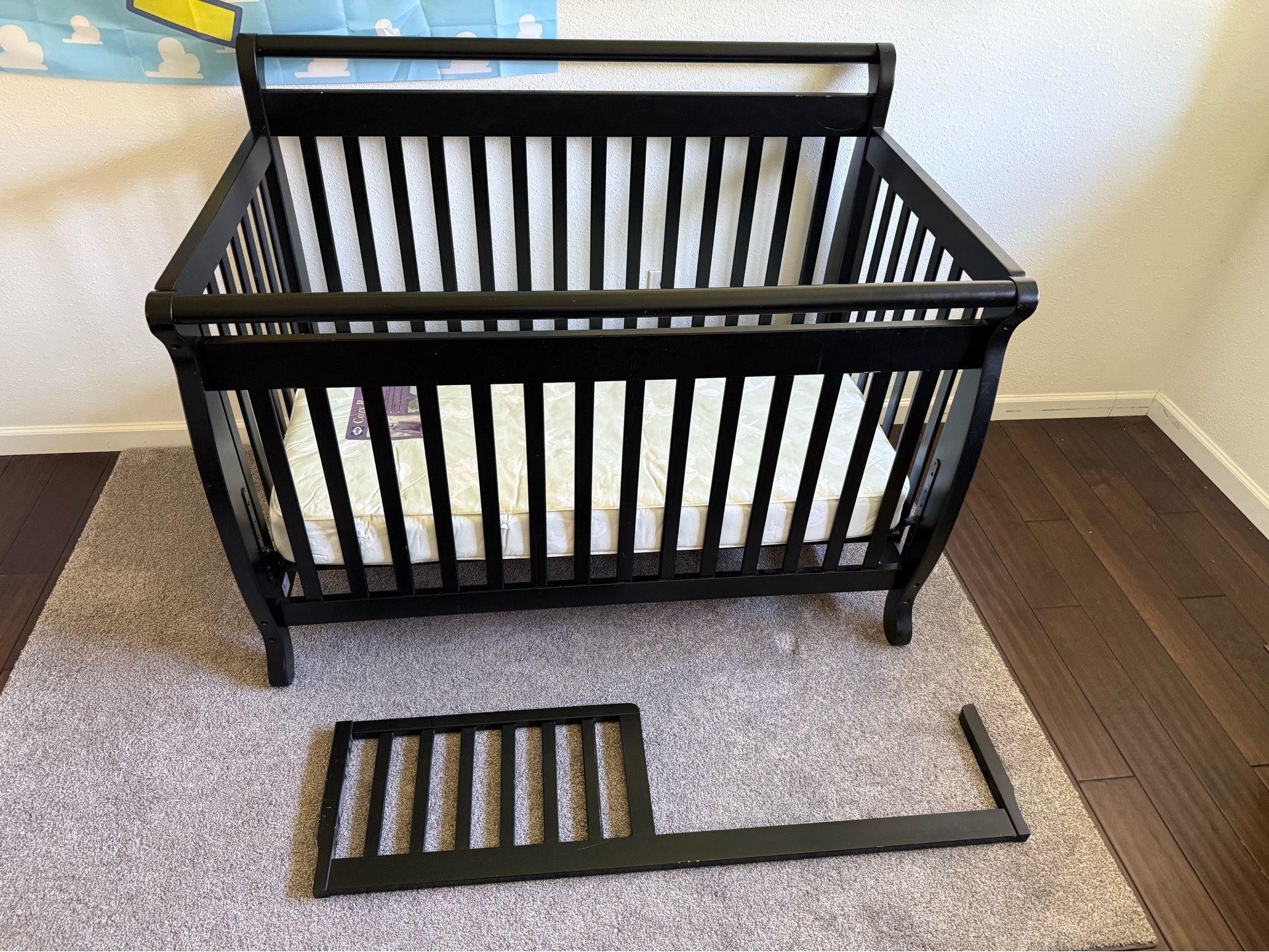 Baby crib with toddler attachment