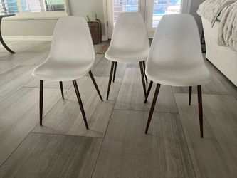 3 stylish white chairs