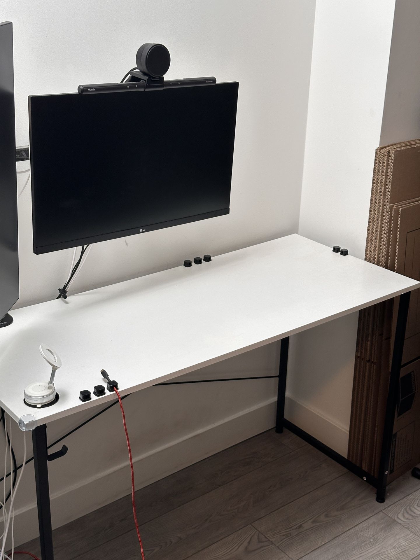 Computer desk with cable clips and Magsafe phone stand