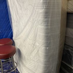 Queen solid memory foam mattress with Box springs. Brand new condition in plastic I can also deliver