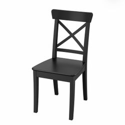 Set of four wood dining chairs on black color