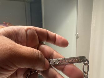 Esclava de plata con el nombre de Juan. En  horo