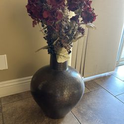 metal vase with faux flowers