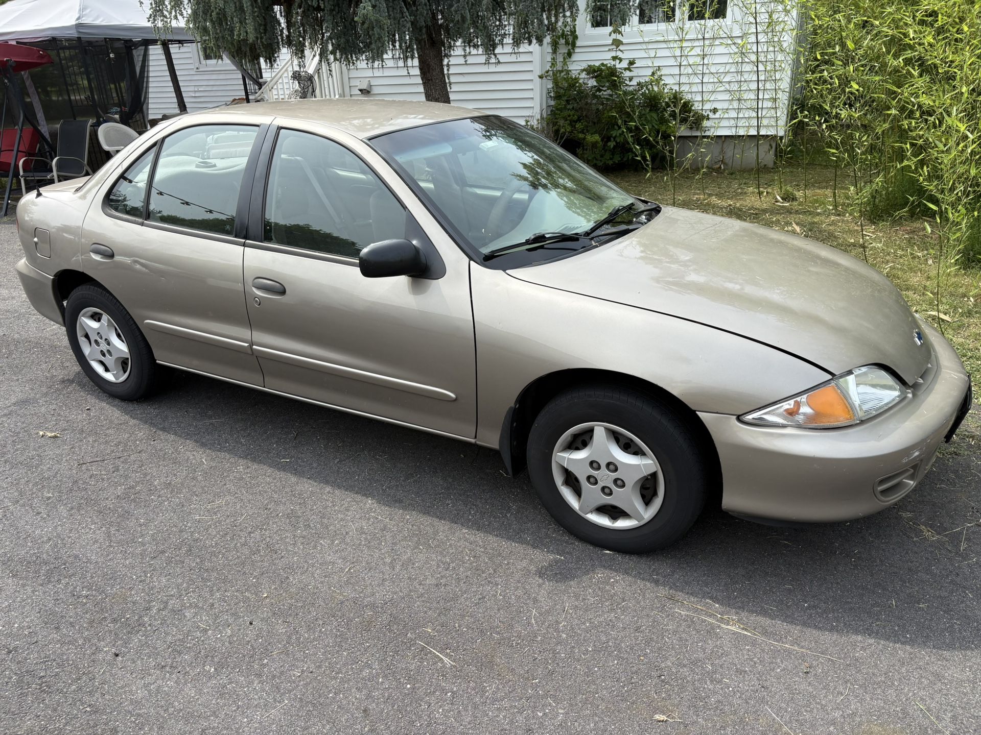 2001 Chevrolet Cavalier Beige Tan 4 door 2.2 model with Low miles 122,000 miles original owner. Honda Toyota Hyundai Kia Lexus Ford Truck weights