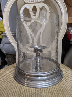 Polished aluminum pedestal candle holder